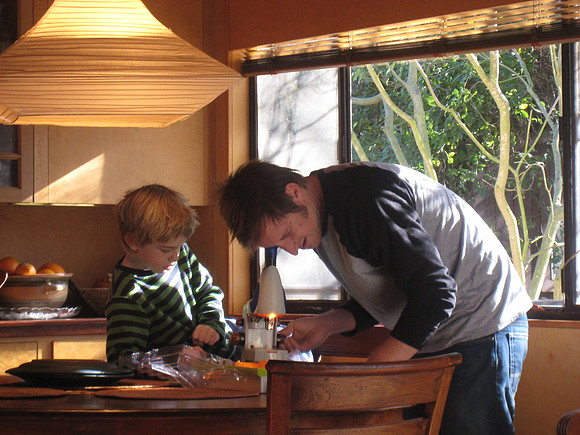 John Adjusts the Microscope for Aidan